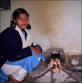 20120514-Indian girl making tea over open fire.jpg